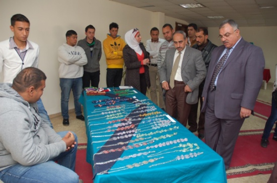 بازار خيري لذوي الاحتياجات الخاصة في الطفيلة التقنية " صور "